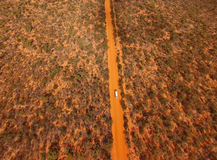 A car travels down a gravel road not far from Wooleen Station, Insta Photo: @TheVagabondLife